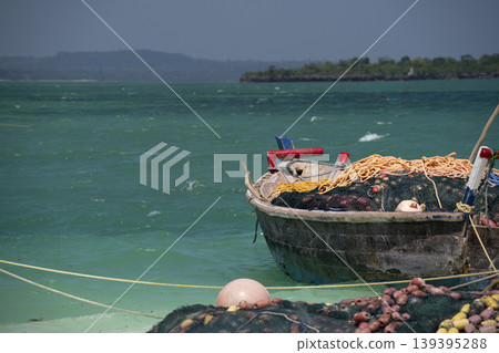 fishing wooden boat moored on the beach in Zanzibar at sunny day 139395288