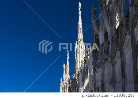 Madonnina golden statue and marble spiers and statues of Milan Cathedral Madonnina golden statue and marble spiers and statues of Milan Cathedral 139395292