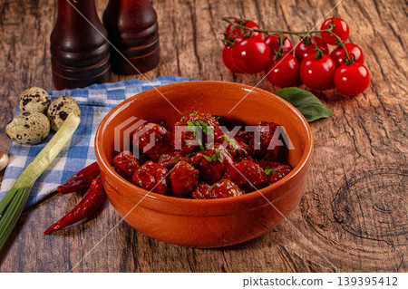 Appetizing Meatballs in Rich Tomato Sauce with Fresh Ingredients on Wooden Table Appetizing Meatballs in Rich Tomato Sauce with Fresh Ingredients on Wooden Table 139395412