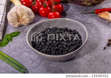 Black Beans in Bowl, Fresh Cherry Tomatoes, Garlic, Artichoke, Chili, Herbs, Spices on Grey Background Black Beans in Bowl, Fresh Cherry Tomatoes, Garlic, Artichoke, Chili, Herbs, Spices on Grey Background 139395452