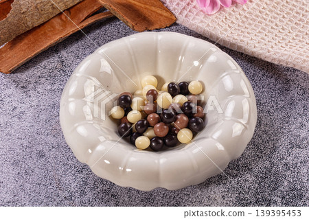 Assorted White Milk Dark Chocolate Candies White Bowl Cinnamon Sticks Assorted White Milk Dark Chocolate Candies White Bowl Cinnamon Sticks 139395453