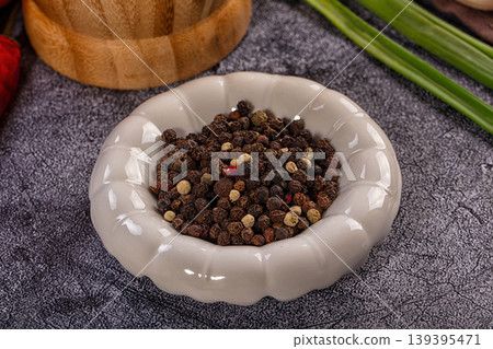 Mixed peppercorns in ceramic bowl, black, white, green, red spices for cooking seasoning Mixed peppercorns in ceramic bowl, black, white, green, red spices for cooking seasoning 139395471