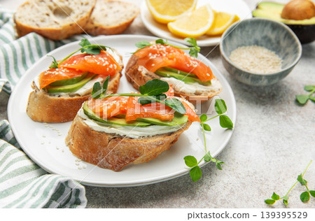 Bruschetta with salmon, avocado, and cream cheese Bruschetta with salmon, avocado, and cream cheese 139395529