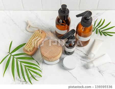 Skincare beauty products on marble with plant leaves 139395536