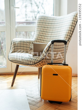 Yellow suitcase and handbag preparing for travel journey Yellow suitcase and handbag preparing for travel journey 139395552