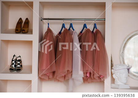 Pink Tulle Skirts Hanging on Rack with High Heels and Plaster Head Decor Pink Tulle Skirts Hanging on Rack with High Heels and Plaster Head Decor 139395638