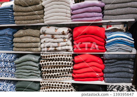 Wall Display of Neatly Folded Knitwear and Winter Sweaters Wall Display of Neatly Folded Knitwear and Winter Sweaters 139395647