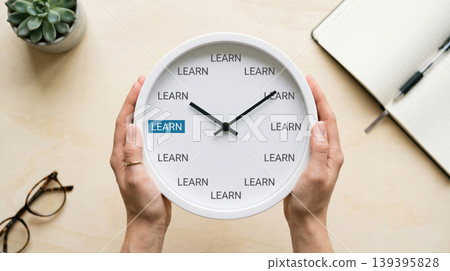 Hands Holding Clock with LEARN Text Education and Self Improvement Concept Hands Holding Clock with LEARN Text Education and Self Improvement Concept 139395828