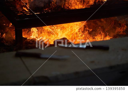Burning fire pit used for roasting lamb during Samaritan Passover ritual Burning fire pit used for roasting lamb during Samaritan Passover ritual 139395850