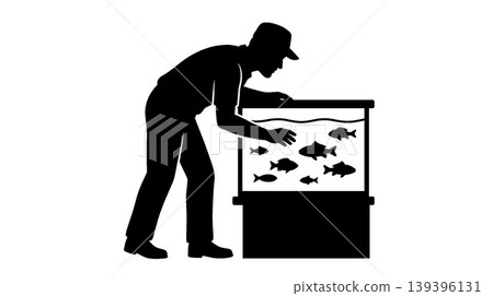 Silhouette of a man tending to fish in an aquarium Silhouette of a man tending to fish in an aquarium 139396131