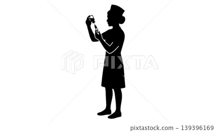 Silhouette of a nurse preparing a syringe 139396169