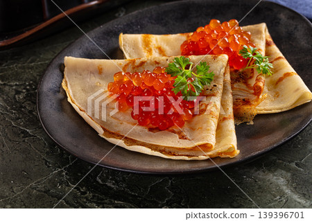 Russain traditional pancakes with red caviar Russain traditional pancakes with red caviar 139396701