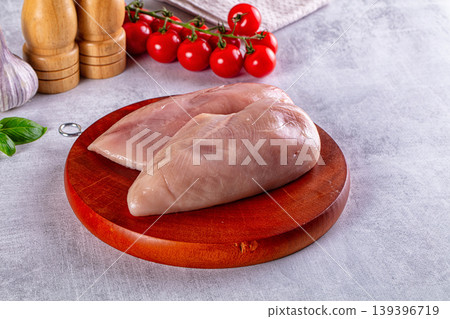 Fresh raw chicken breast over board Fresh raw chicken breast over board 139396719