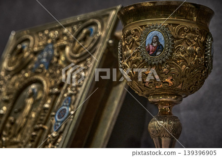 Ornate Orthodox church chalice with icon of Jesus Christ, religious liturgical object close up 139396905