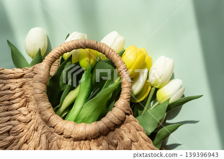 Mothers Day Straw Bag with Colorful Tulips on Blue Background Mothers Day Straw Bag with Colorful Tulips on Blue Background 139396943