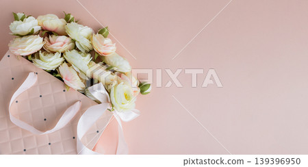 Pink Gift Bag with Flowers on Pink Background Pink Gift Bag with Flowers on Pink Background 139396950