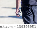 Petanque player with a boule in his hand 139396951