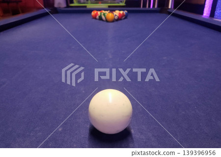 Racked billiard balls on purple pool table Racked billiard balls on purple pool table 139396956