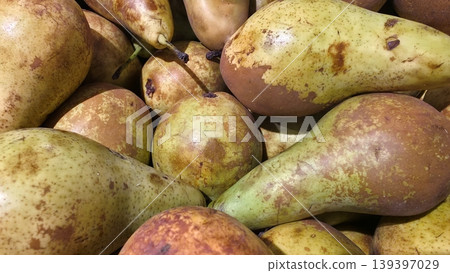 Fresh ripe Conference pears background, organic seasonal fruits close-up Fresh ripe Conference pears background, organic seasonal fruits close-up 139397029