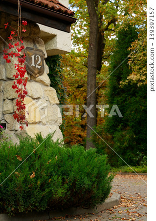 manor town house porch facade bushes garden back yard court space vertical photography autumn aesthetic 139397157
