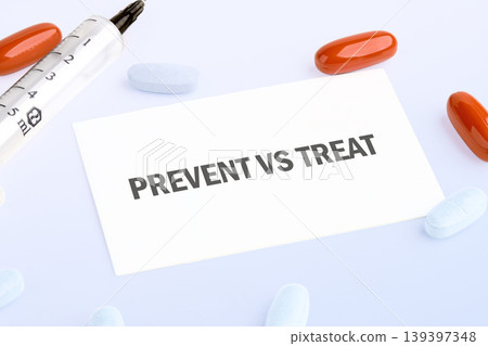 A crucial medical choice, Prevent versus Treat, is presented on a white note, surrounded by a syringe, orange capsules, and light blue pills on a clean white background A crucial medical choice, Prevent versus Treat, is presented on a white note, surrounded by a syringe, orange capsules, and light blue pills on a clean white background 139397348