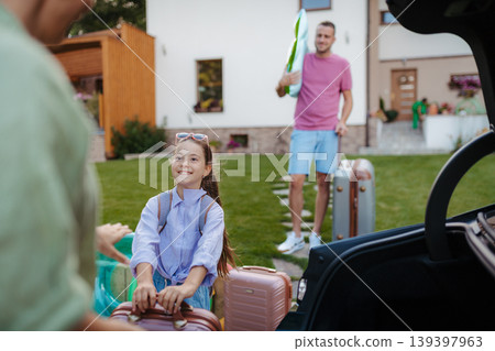 Family loading car and preparing for summer vacation. Family loading car and preparing for summer vacation. 139397963