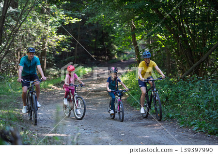 Active family enjoying biking adventure in scenic landscape. 139397990
