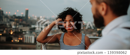 Two people talking the rooftop of a modern building. Two people talking the rooftop of a modern building. 139398062