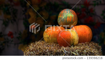 Autumn harvest of pumpkins displayed on a bale of straw for October holidays Autumn harvest of pumpkins displayed on a bale of straw for October holidays 139398218