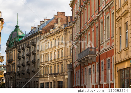 Historic European architecture with ornate facades and a green domed building Historic European architecture with ornate facades and a green domed building 139398234
