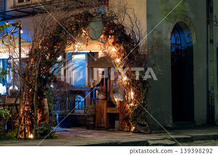 Enchanting evening street decoration with warm lights and natural elements Enchanting evening street decoration with warm lights and natural elements 139398292