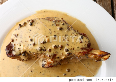 Entrecote Steak with Green Pepper Sauce on Plate Entrecote Steak with Green Pepper Sauce on Plate 139398317
