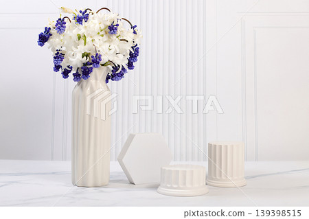 Beautiful banner with hyacinths and muscari in a vase and empty, varied product display stands, design template, and a display. Abstract floral arrangement for a product display business card, 139398515