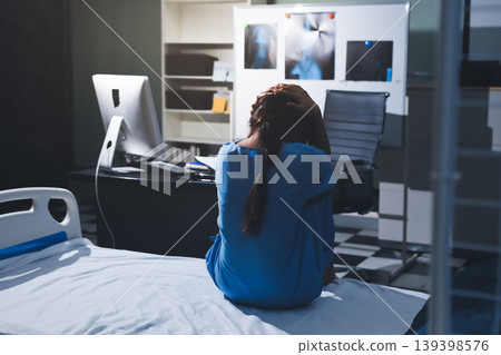 A patient with depression looks outside. 139398576