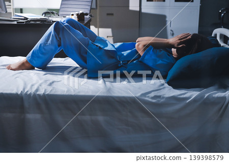 A patient with depression looks outside. 139398579