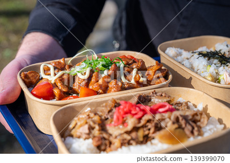 Juicy poultry and beef with rice. Closeup of glazed chicken and beef served over rice Juicy poultry and beef with rice. Closeup of glazed chicken and beef served over rice 139399070