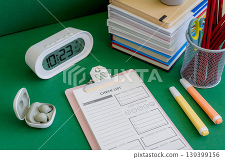Colorful school supplies on a green background Colorful school supplies on a green background 139399156