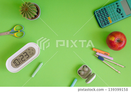 Colorful school supplies on a green background Colorful school supplies on a green background 139399158