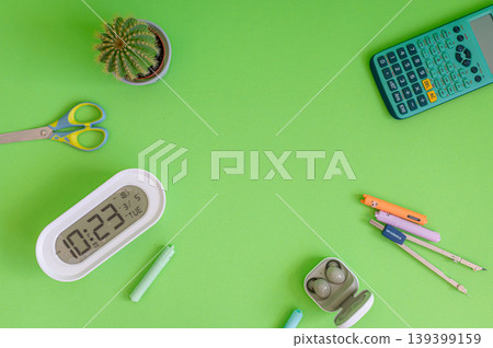 Colorful school supplies on a green background Colorful school supplies on a green background 139399159