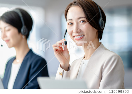 A woman working at a call center 139399893