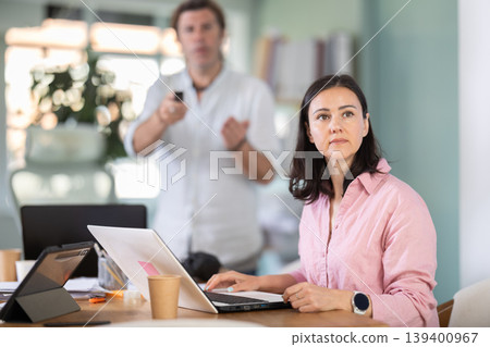 Manager gives presentation using remote control Manager gives presentation using remote control 139400967
