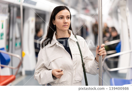 Portrait of beautiful brunette in subway wagon Portrait of beautiful brunette in subway wagon 139400986