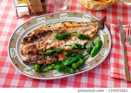 Grilled sea bass with peppers Grilled sea bass with peppers 139401061