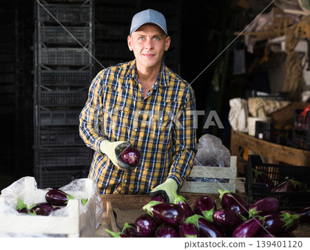 Man working in vegetable warehouse Man working in vegetable warehouse 139401120