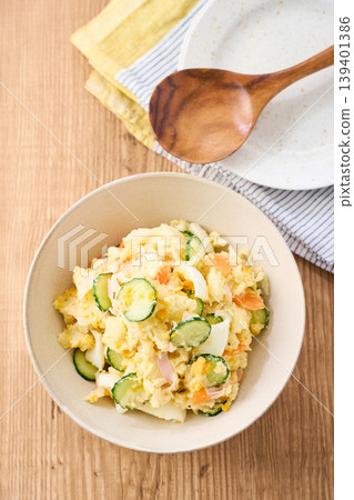 Potato salad, a home-style dish with cucumber, ham, and hard-boiled egg. Potato salad, a home-style dish with cucumber, ham, and hard-boiled egg. 139401386