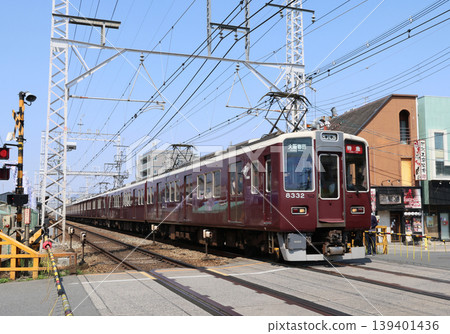Hankyu Kyoto Line 8300 series train running near Higashimukō Station. Hankyu Kyoto Line 8300 series train running near Higashimukō Station. 139401436