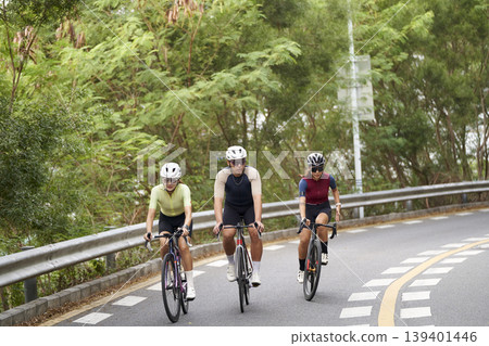young asian people riding bicycle outdoors 139401446