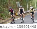 young asian people riding bicycle outdoors 139401448