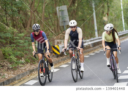 young asian people riding bicycle outdoors 139401448