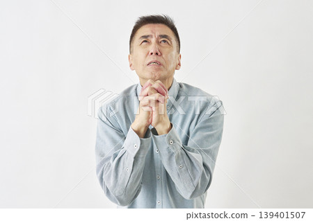 Man praying on white background Man praying on white background 139401507